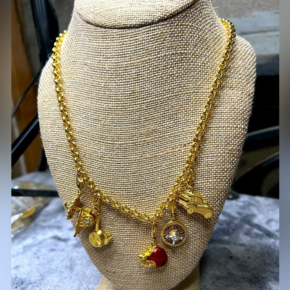 Gold toned Charm Necklace featuring Roulette Wheel Koi Fish Rickshaw Apple Car
